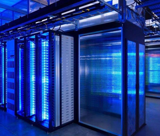 Rows of blue-lit server racks in a data centre